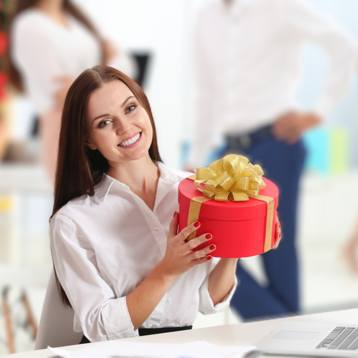 Woman with gift at work holiday party